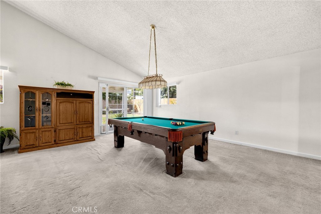 14721 Riata Street Midway City, CA 92655 - Photo 12 of 37 a room with pool table and windows