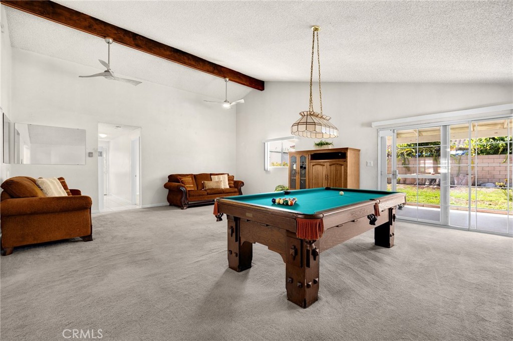 14721 Riata Street Midway City, CA 92655 - Photo 13 of 37 a room with furniture pool table and a window