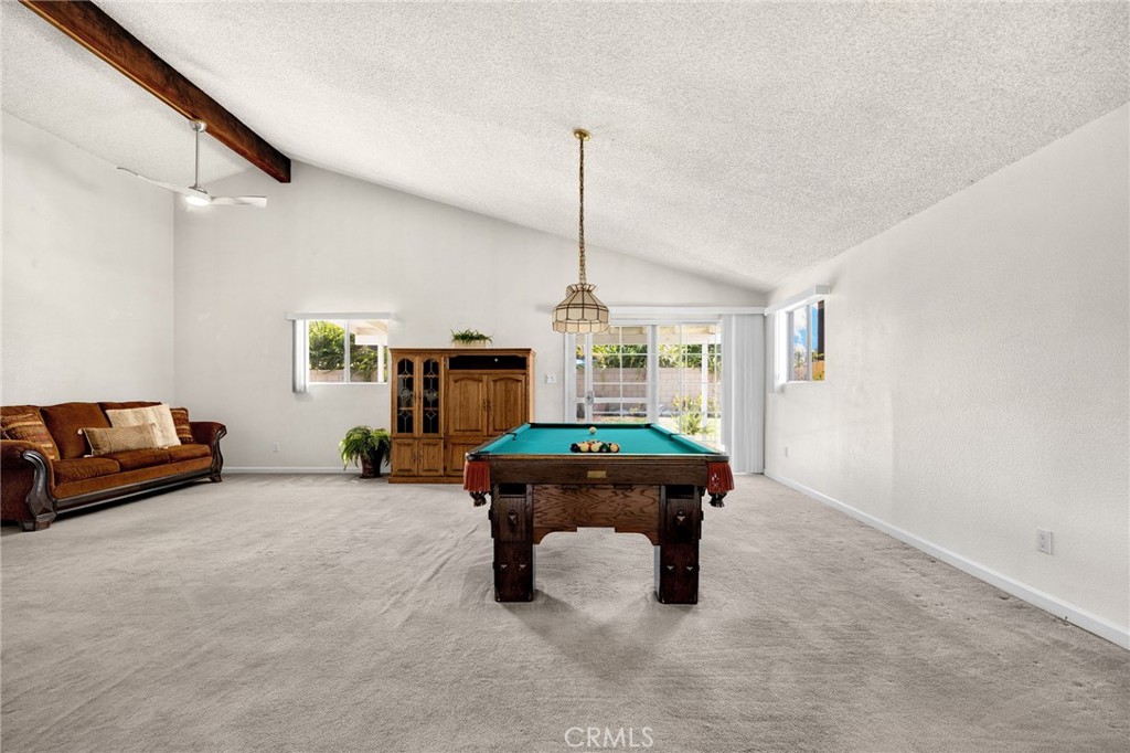 14721 Riata Street Midway City, CA 92655 - Photo 14 of 37 a living room with furniture and a table