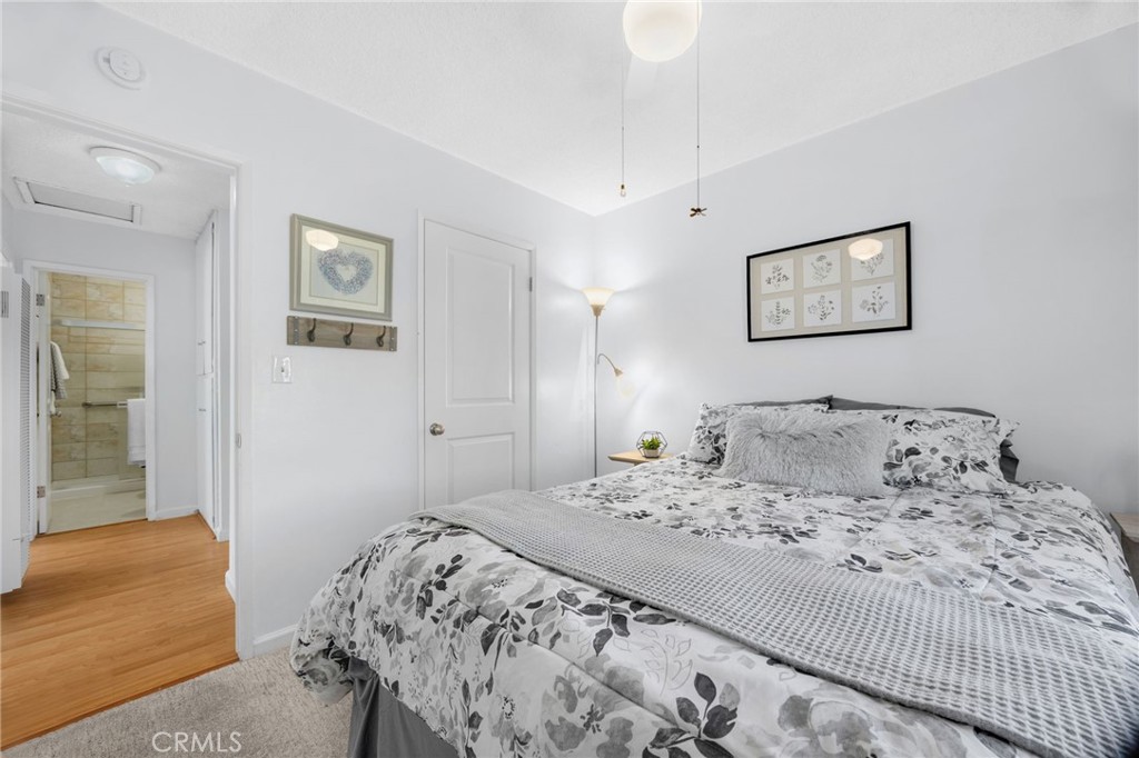 14721 Riata Street Midway City, CA 92655 - Photo 18 of 37 a bedroom with a large bed and a window