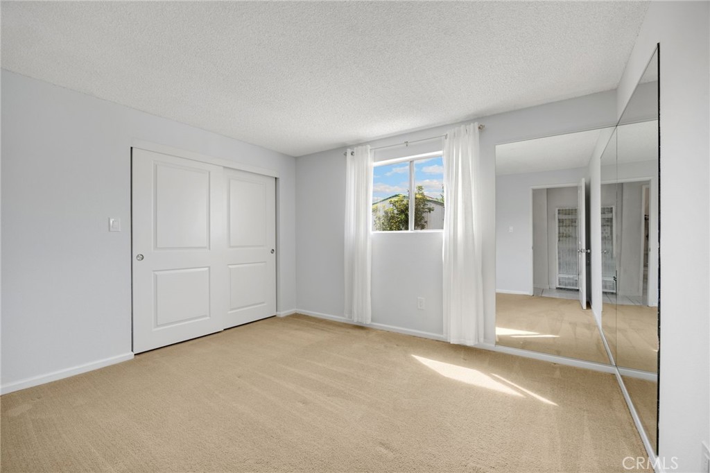 14721 Riata Street Midway City, CA 92655 - Photo 26 of 37 an empty room with windows