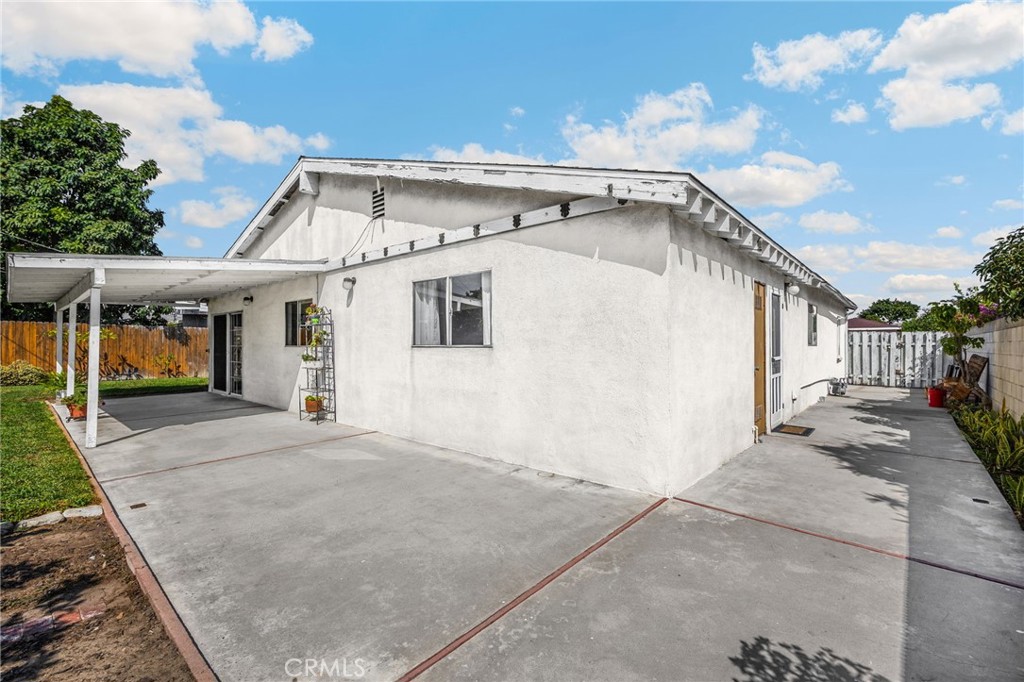 14721 Riata Street Midway City, CA 92655 - Photo 33 of 37 a view of a white house with many windows