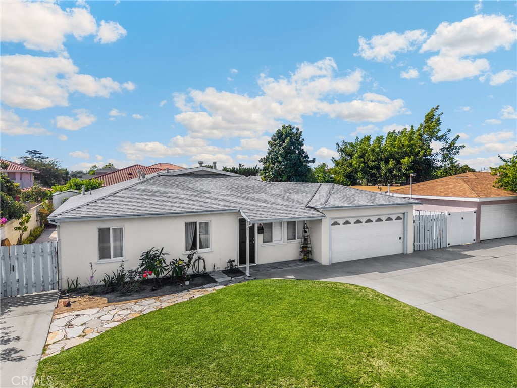 14721 Riata Street Midway City, CA 92655 - Photo 36 of 37 a view of house with yard and green space