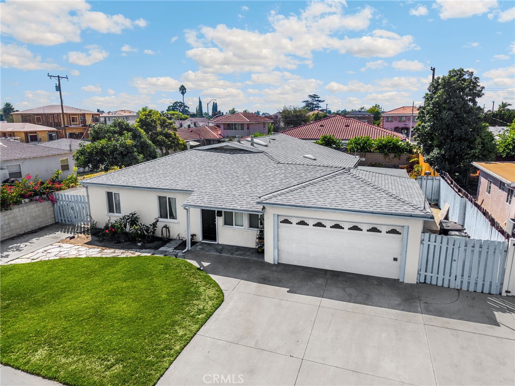 14721 Riata Street Midway City, CA 92655 - Photo 37 of 37 a aerial view of a house with a yard and garage