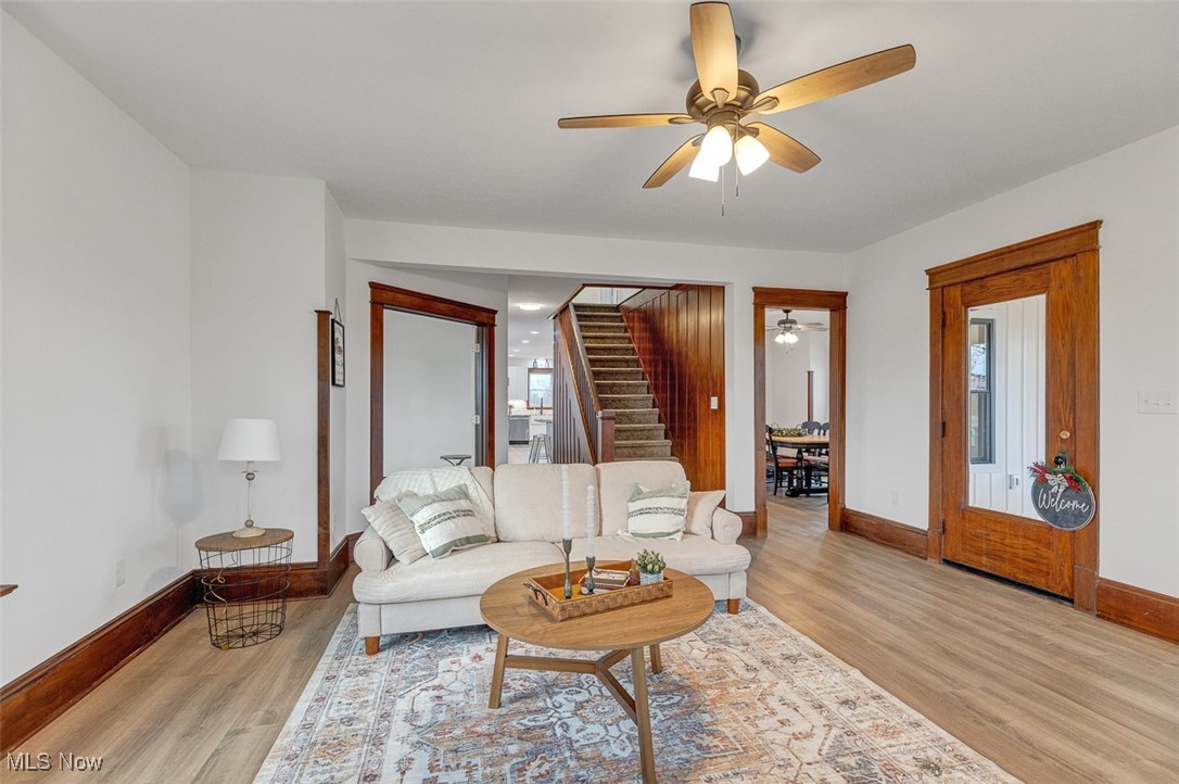 6517 Chippewa Road Medina, OH 44256 - Photo 10 of 45 Living area with light wood-style flooring, ceiling fan, and stairway
