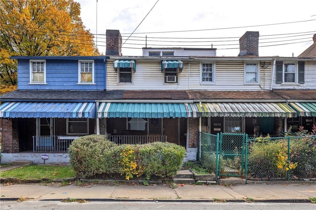 1616 Montier Street Pittsburgh, PA 15221 - Photo 2 of 22 a front view of a house with garden