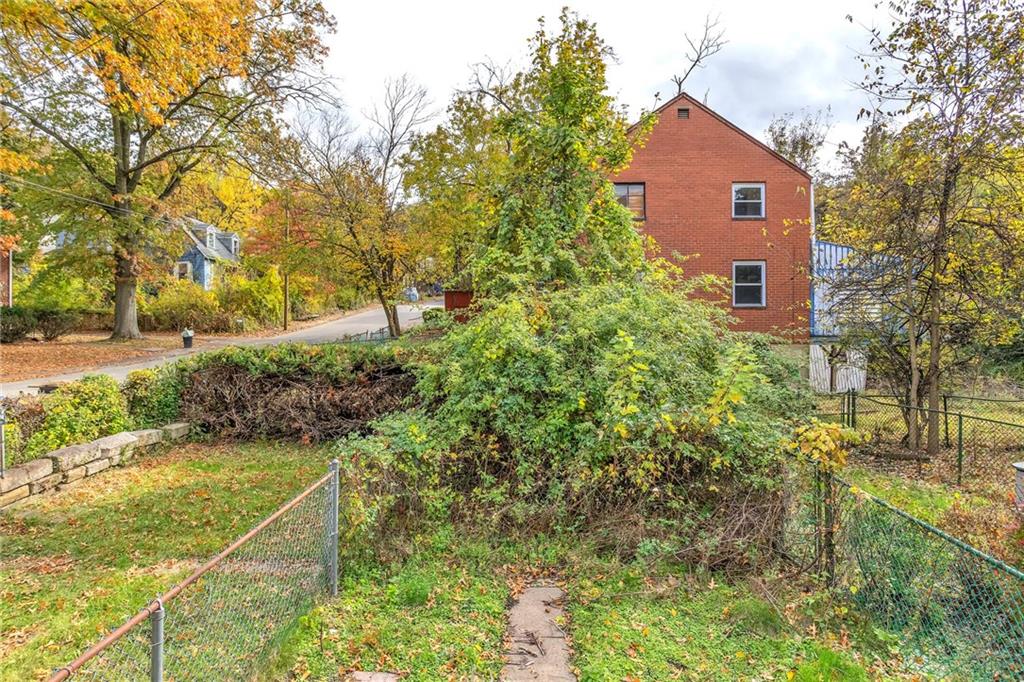 1616 Montier Street Pittsburgh, PA 15221 - Photo 22 of 22 a view of a big yard with plants and large trees