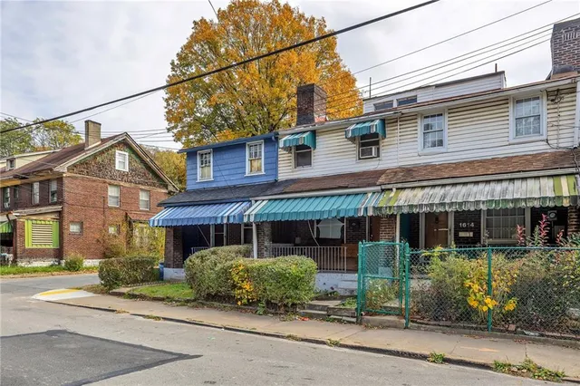 front view of a house with a patio