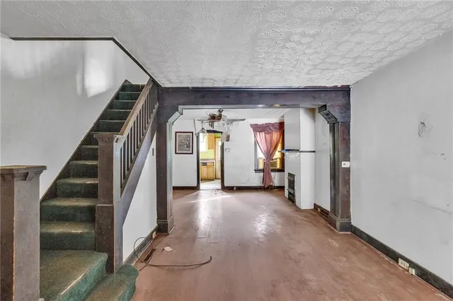 a view of entryway with wooden floor