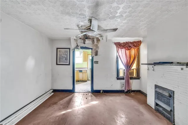 a kitchen with a stove a sink and a refrigerator