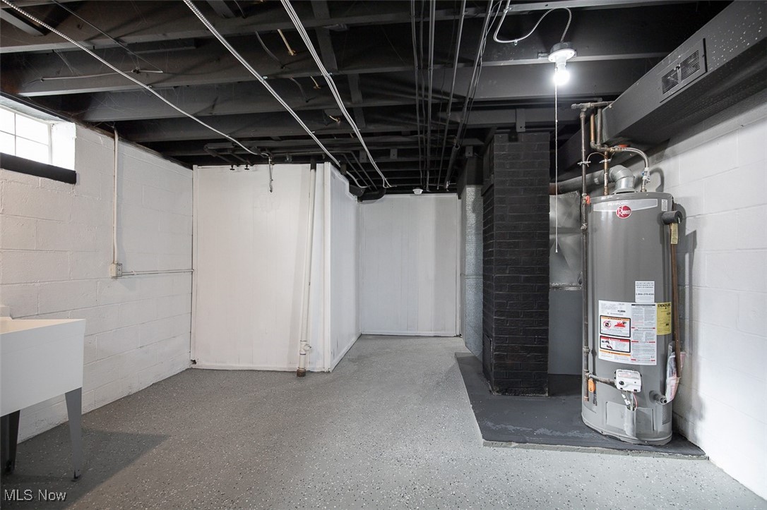 4631 Belfiore Road Cleveland, OH 44128 - Photo 21 of 28 Basement with water heater and a sink