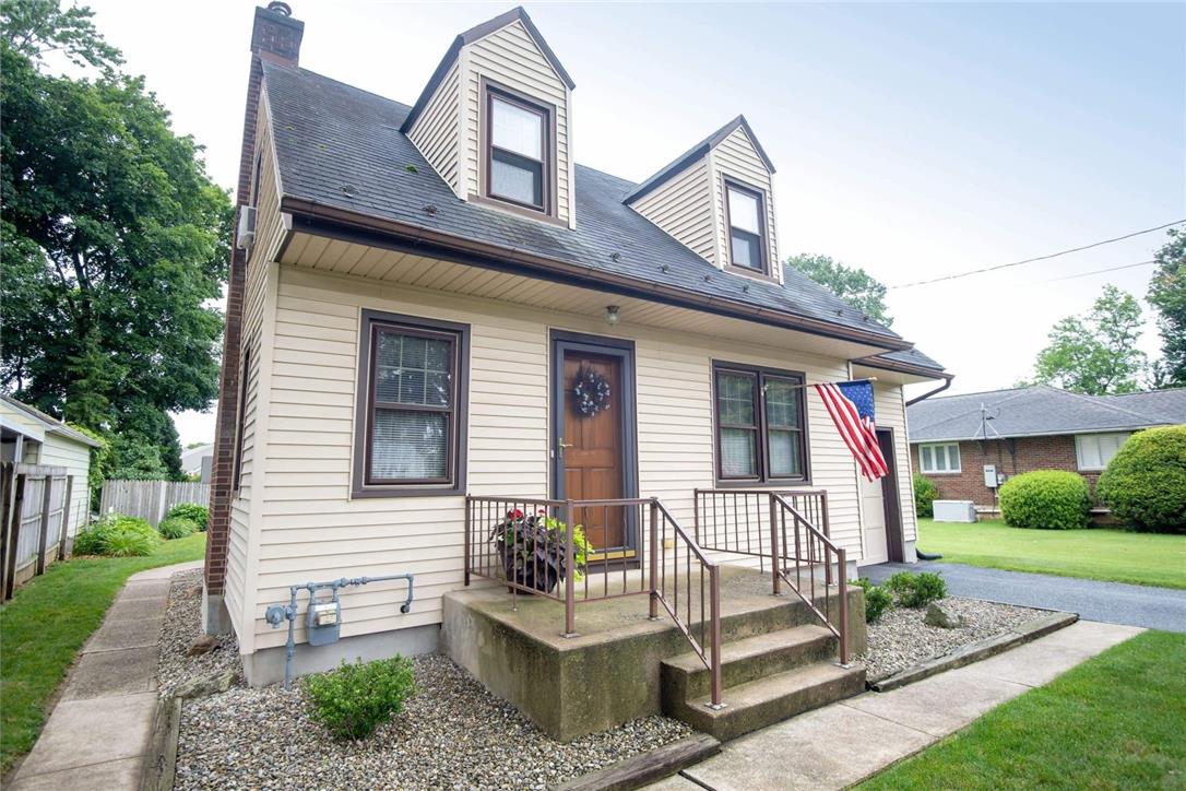 706 Stones Crossing Road Easton, PA 18045 - Photo 2 of 40 A charming cape style home with a welcoming front porch and manicured landscaping.