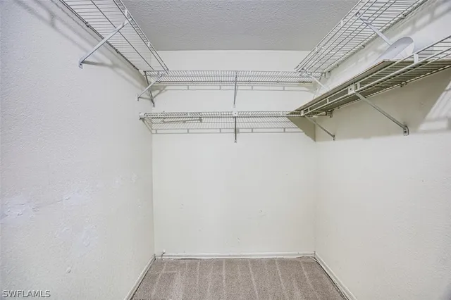 a view of a room with racks on the wall