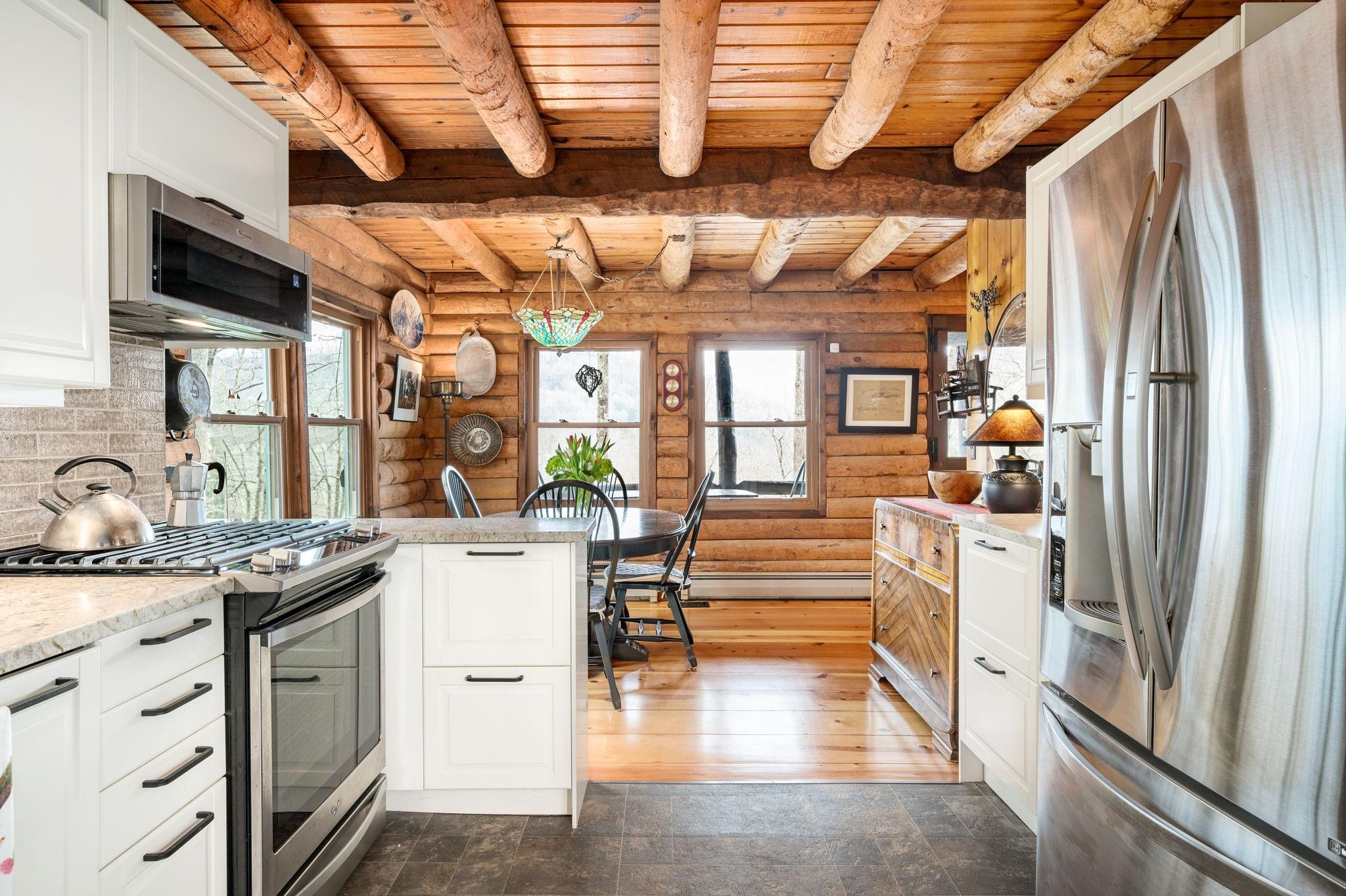 25 Dycus Drive Fairview, NC 28730 - Photo 11 of 30 a kitchen with stainless steel appliances a stove a sink and a refrigerator