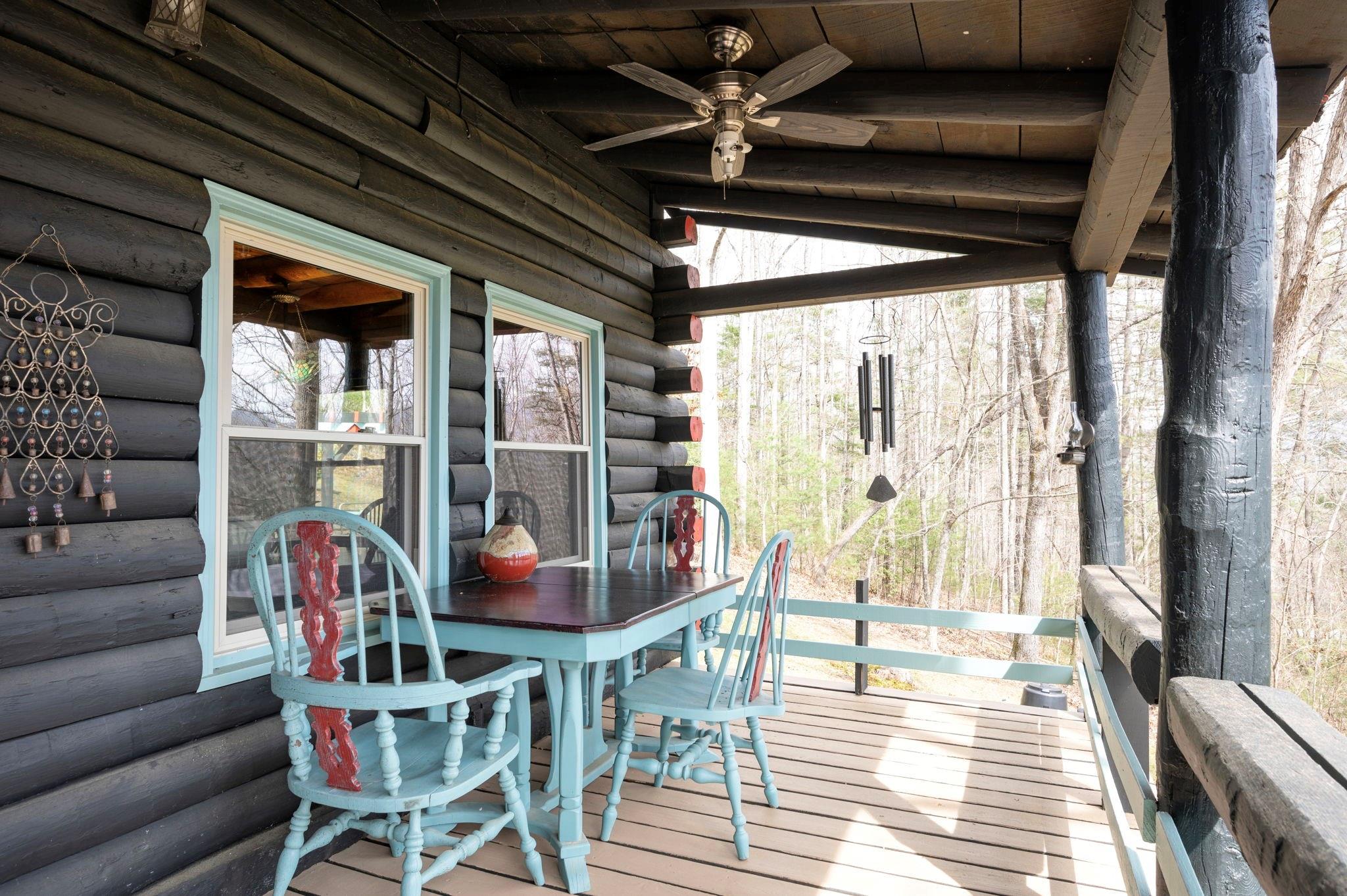 25 Dycus Drive Fairview, NC 28730 - Photo 26 of 30 a dining room with furniture and a floor to ceiling window