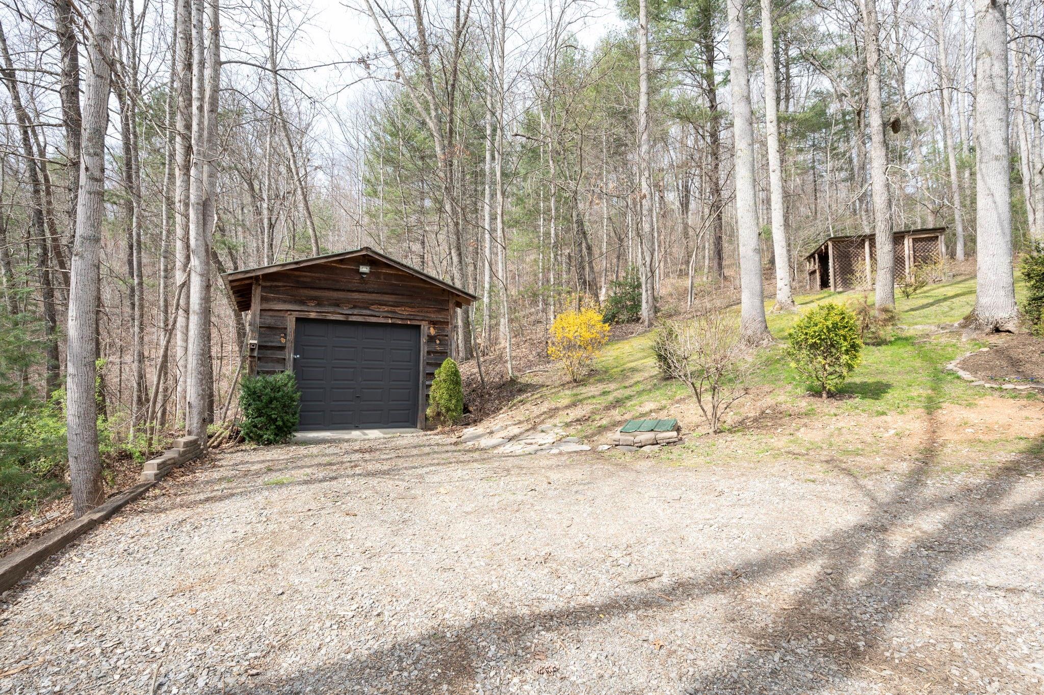 25 Dycus Drive Fairview, NC 28730 - Photo 28 of 30 a front view of a house with a yard and garage
