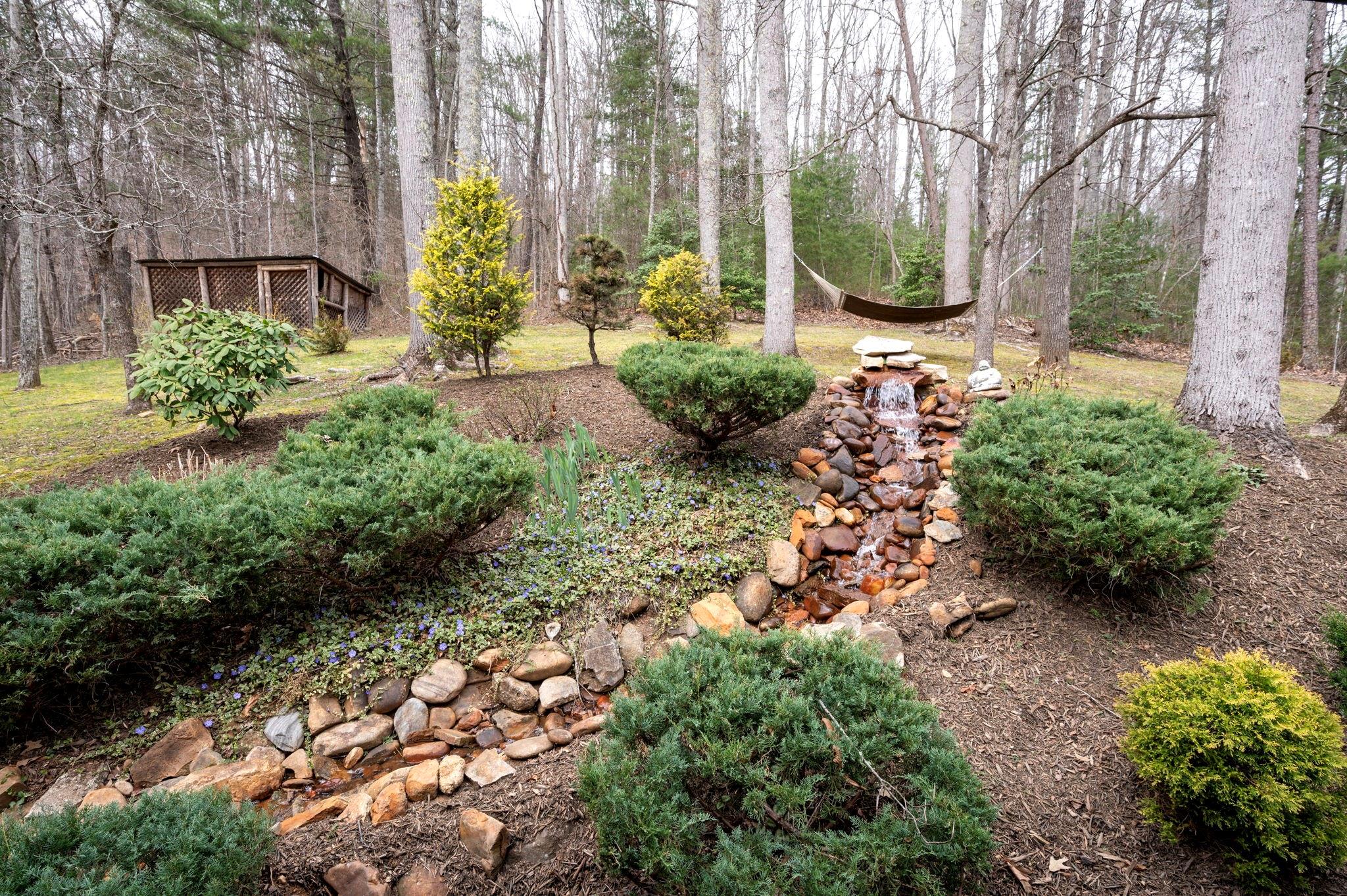 25 Dycus Drive Fairview, NC 28730 - Photo 5 of 30 a view of a garden with a house