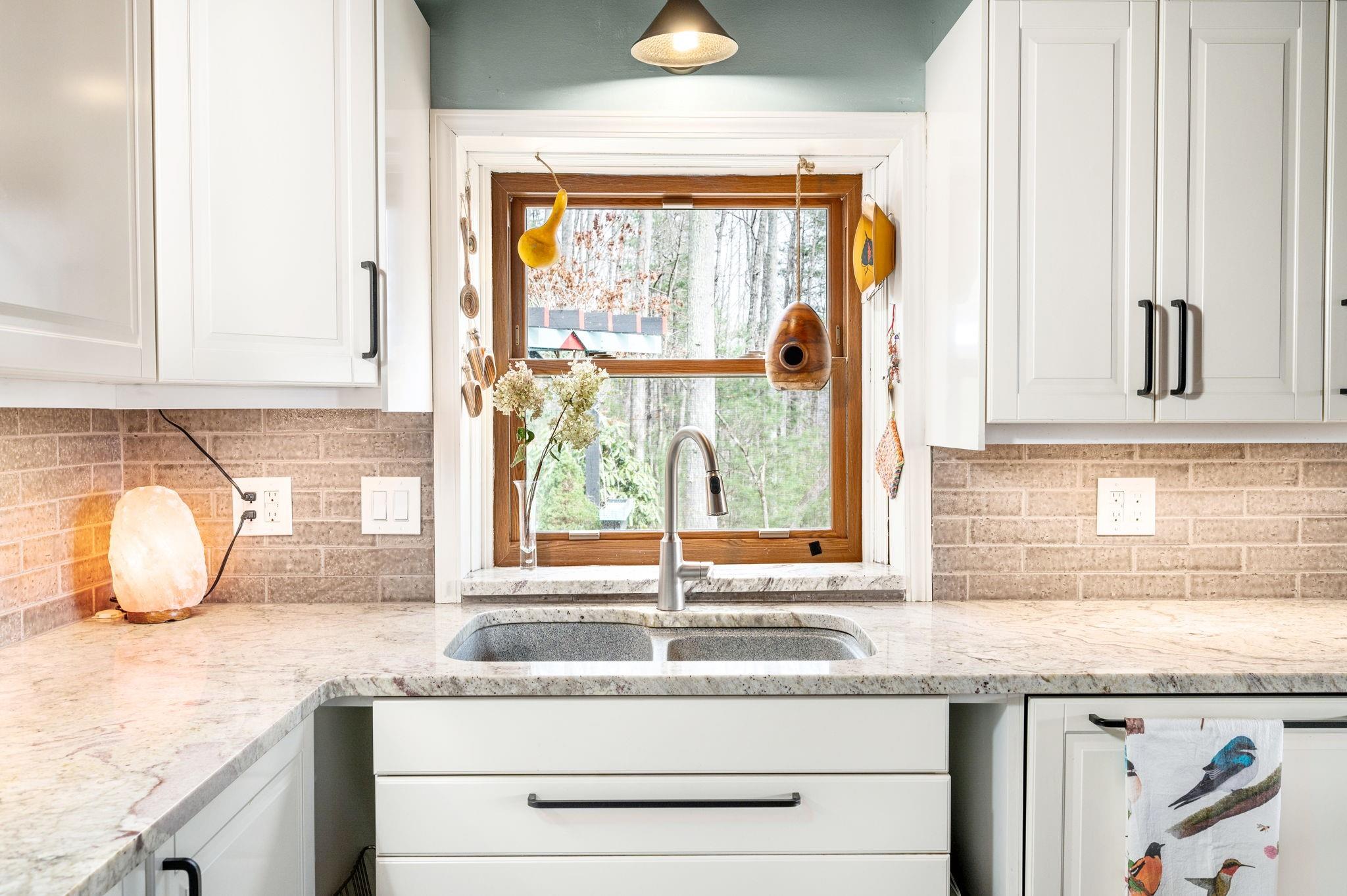 25 Dycus Drive Fairview, NC 28730 - Photo 10 of 30 a kitchen with granite countertop sink and window