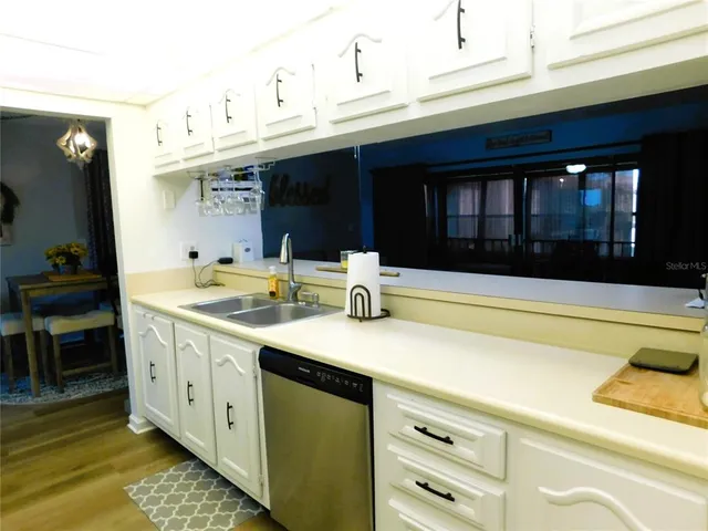 a bedroom with a bed and a chair in it