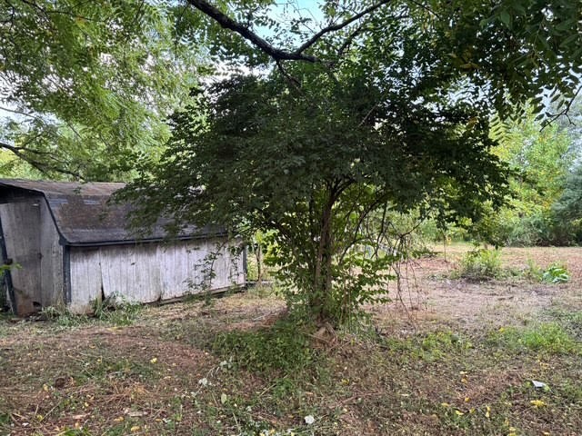 1070 West Rock Quarry Road Clarkrange, TN 38553 - Photo 2 of 12 a backyard of a house with lots of green space