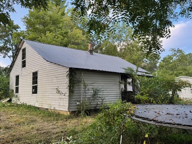 1070 West Rock Quarry Road Clarkrange, TN 38553 - Photo 4 of 12 a view of a house with a yard