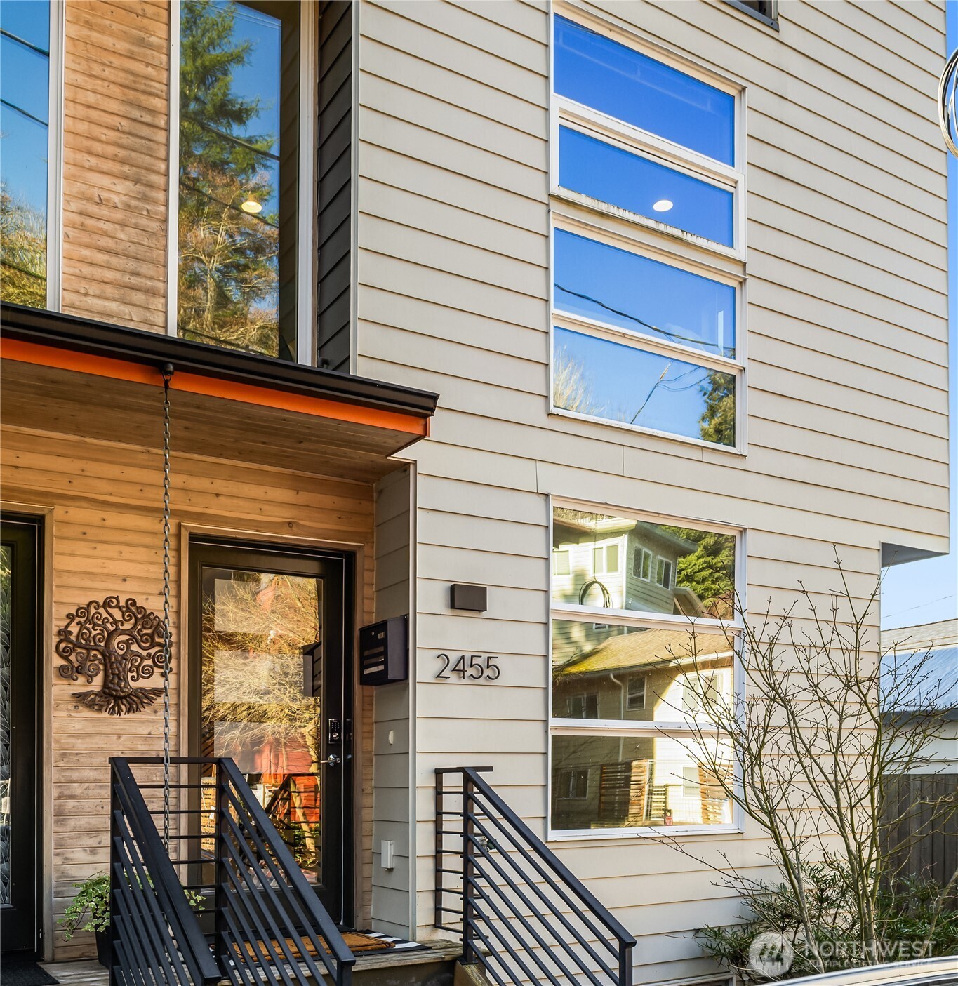 2455 Wickstrom Place Southwest Seattle, WA 98116 - Photo 1 of 36 a view of a balcony with wooden floor and fence