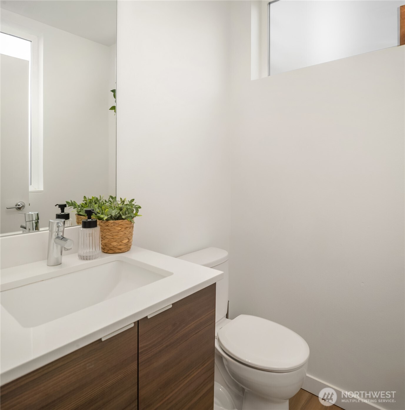 2455 Wickstrom Place Southwest Seattle, WA 98116 - Photo 13 of 36 a bathroom with a sink toilet and a mirror