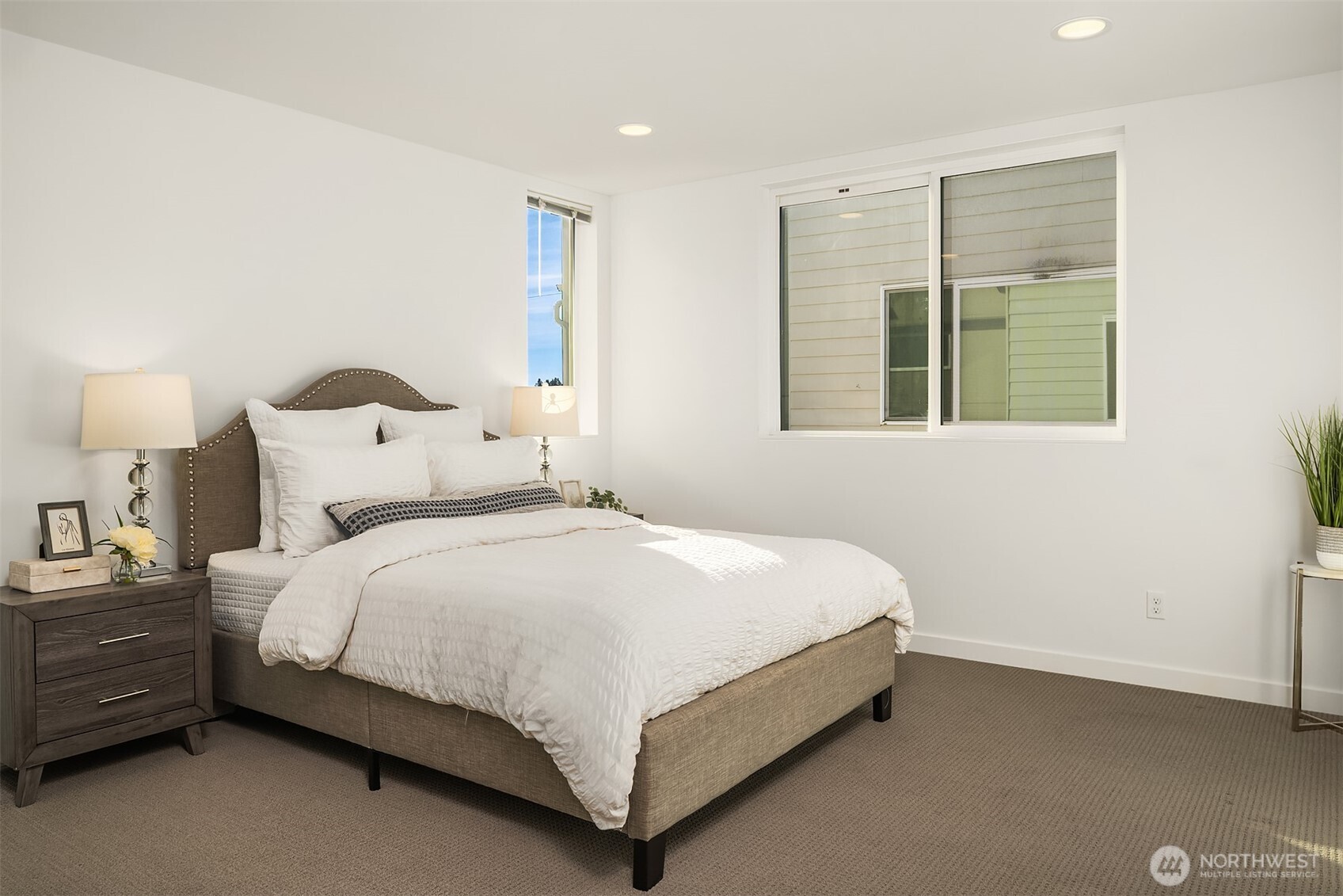 2455 Wickstrom Place Southwest Seattle, WA 98116 - Photo 14 of 36 a bed sitting in a bedroom next to a window