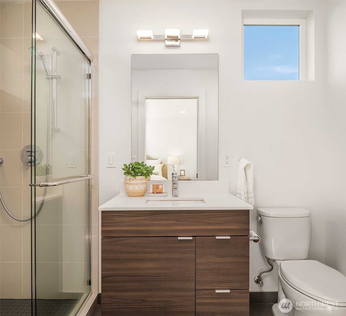 2455 Wickstrom Place Southwest Seattle, WA 98116 - Photo 16 of 36 a bathroom with a sink a toilet and shower