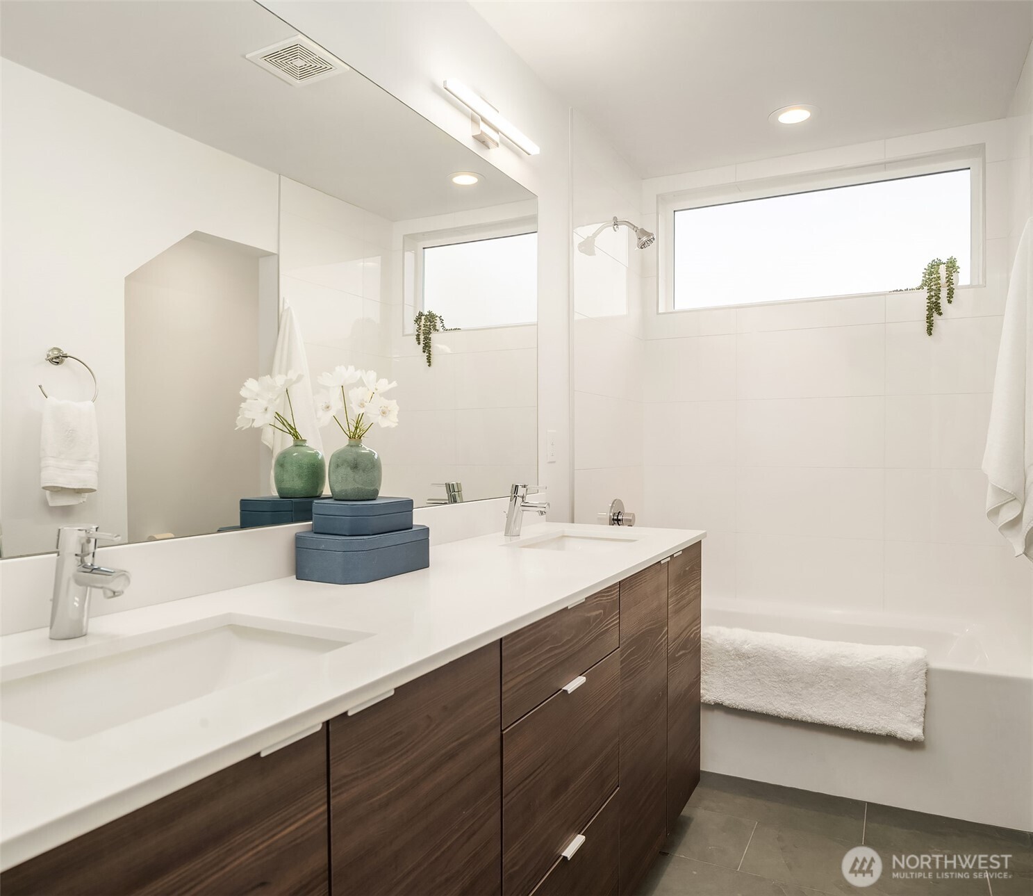 2455 Wickstrom Place Southwest Seattle, WA 98116 - Photo 4 of 36 a bathroom with a sink and a mirror