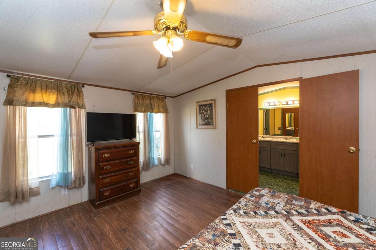 3547 Chapel Lane Blackshear, GA 31516 - Photo 16 of 33 a bedroom with furniture and a window