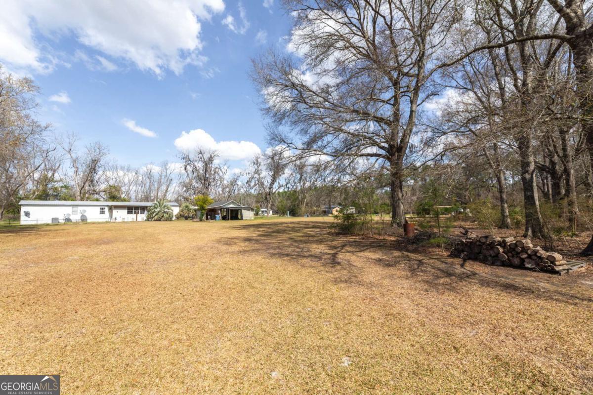 3547 Chapel Lane Blackshear, GA 31516 - Photo 30 of 33 a view of outdoor space with swimming pool and sitting space