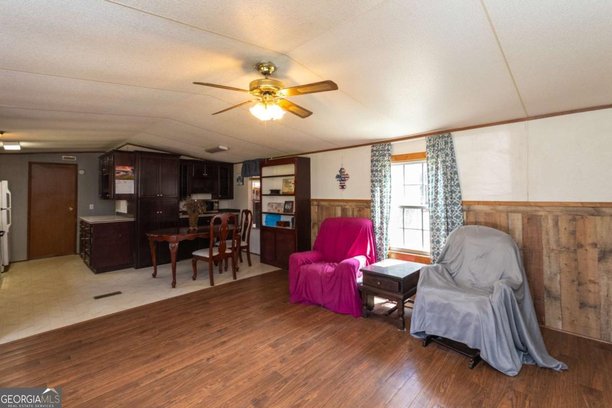3547 Chapel Lane Blackshear, GA 31516 - Photo 6 of 33 a living room with furniture and wooden floor