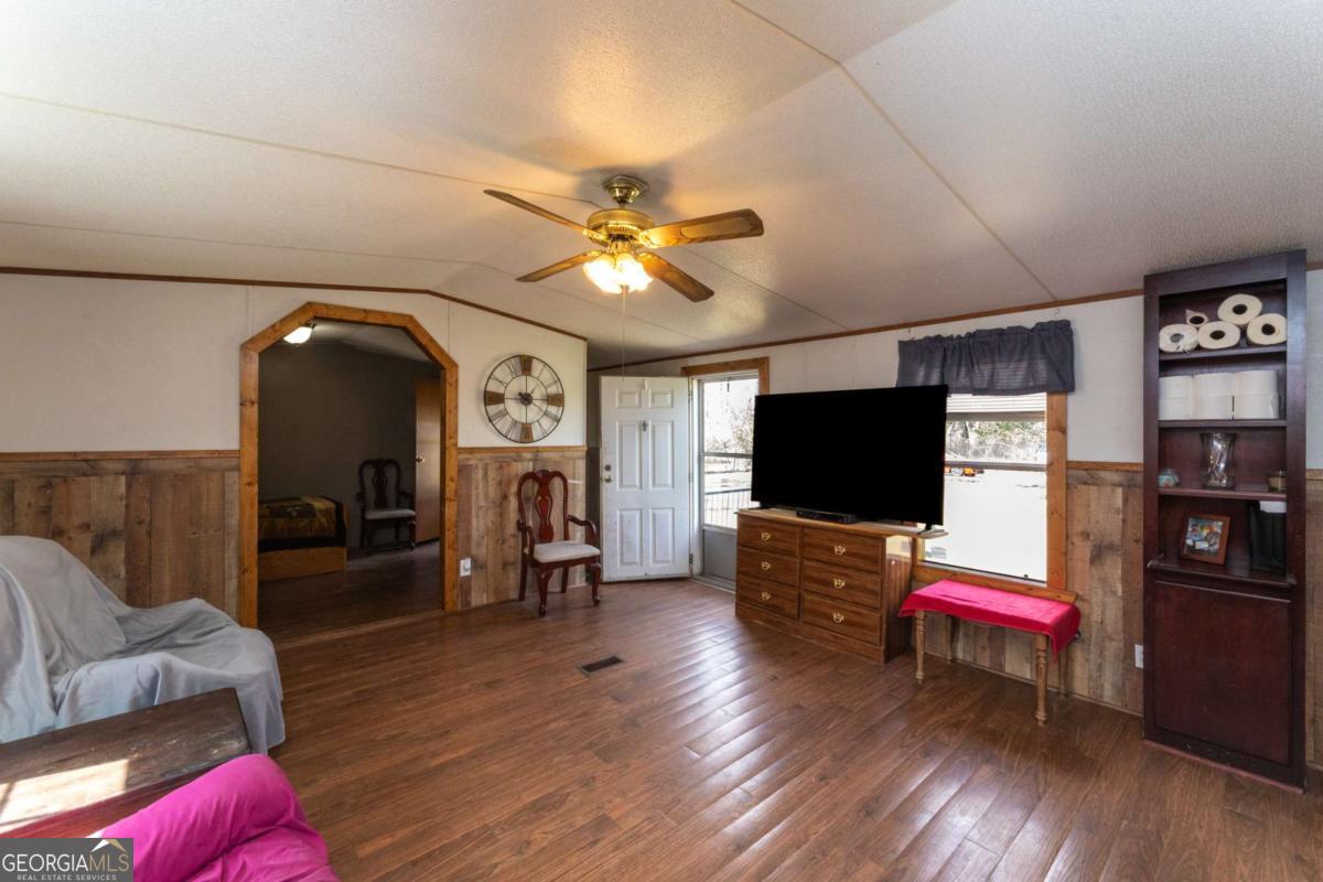 3547 Chapel Lane Blackshear, GA 31516 - Photo 8 of 33 a living room with furniture and a flat screen tv