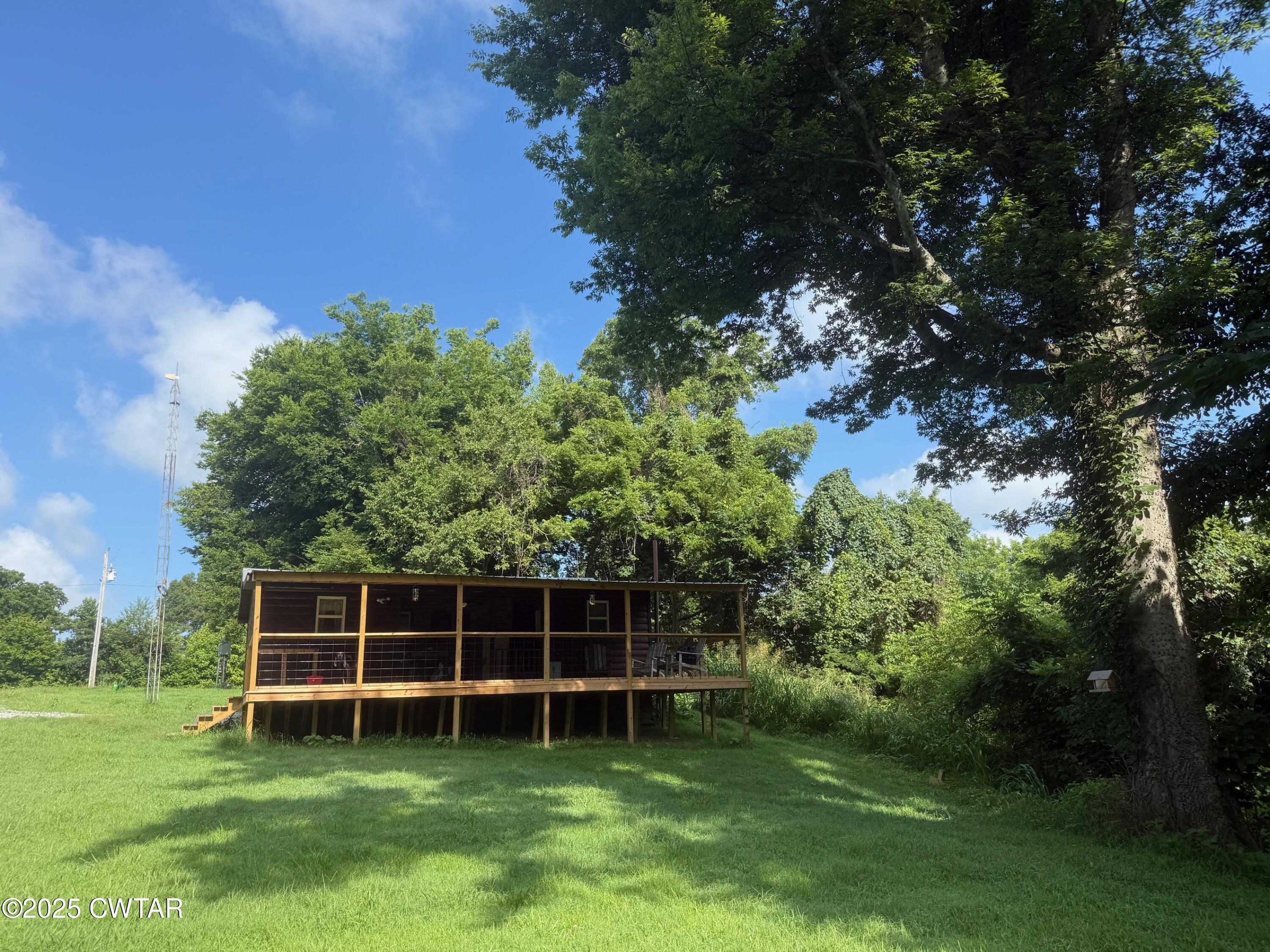 972 Cleve Duke Road Hornbeak, TN 38232 - Photo 19 of 36 a view of a backyard with a garden