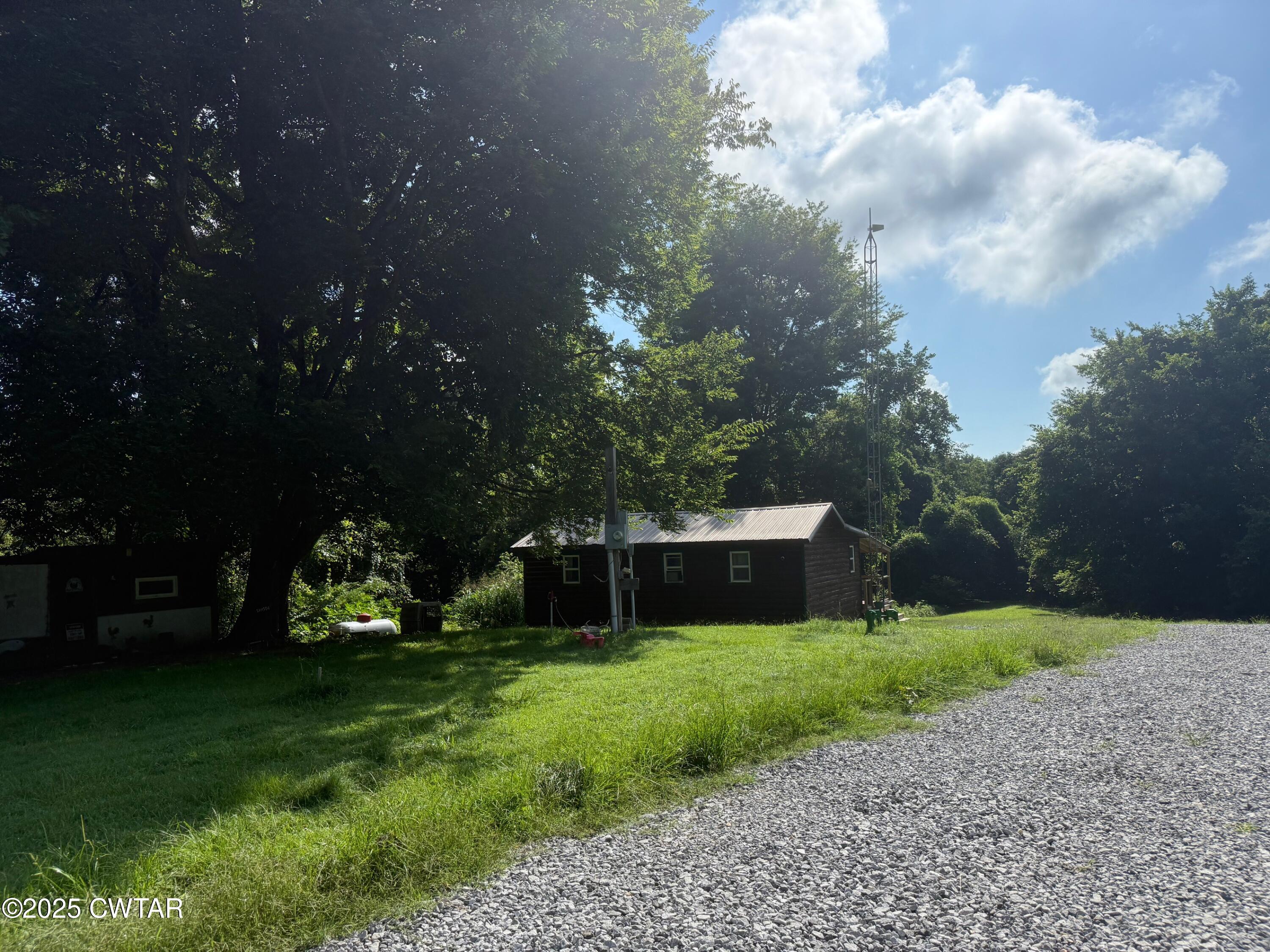 972 Cleve Duke Road Hornbeak, TN 38232 - Photo 30 of 36 a view of a garden with an apartment