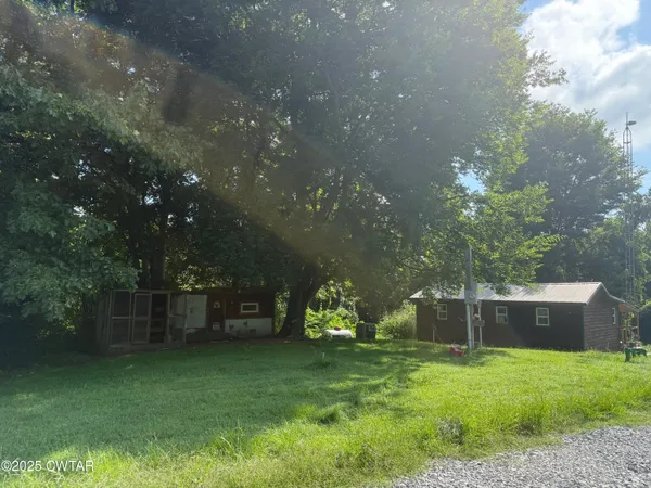 a house with trees in the background