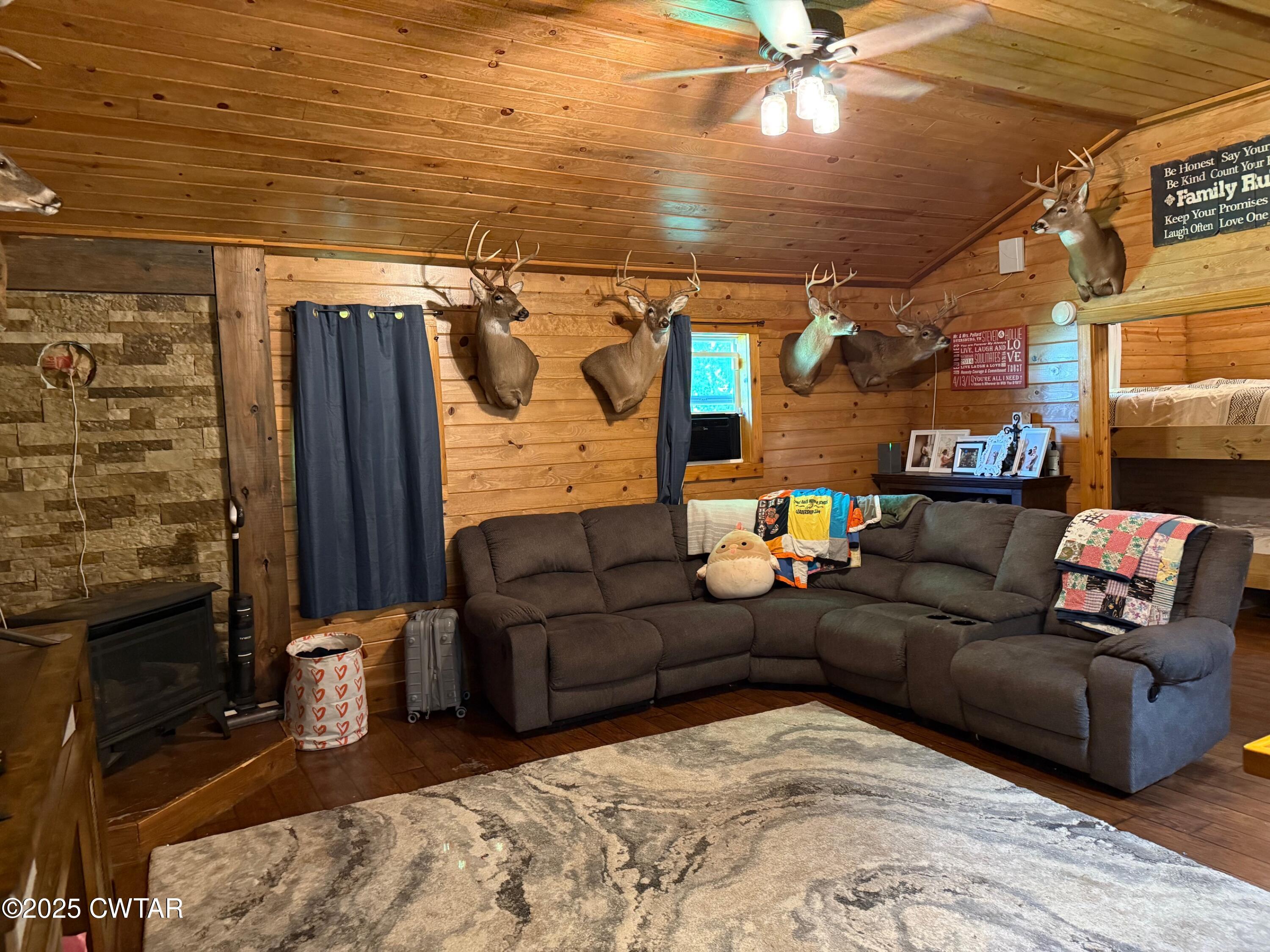 972 Cleve Duke Road Hornbeak, TN 38232 - Photo 4 of 36 a living room with furniture and a fireplace