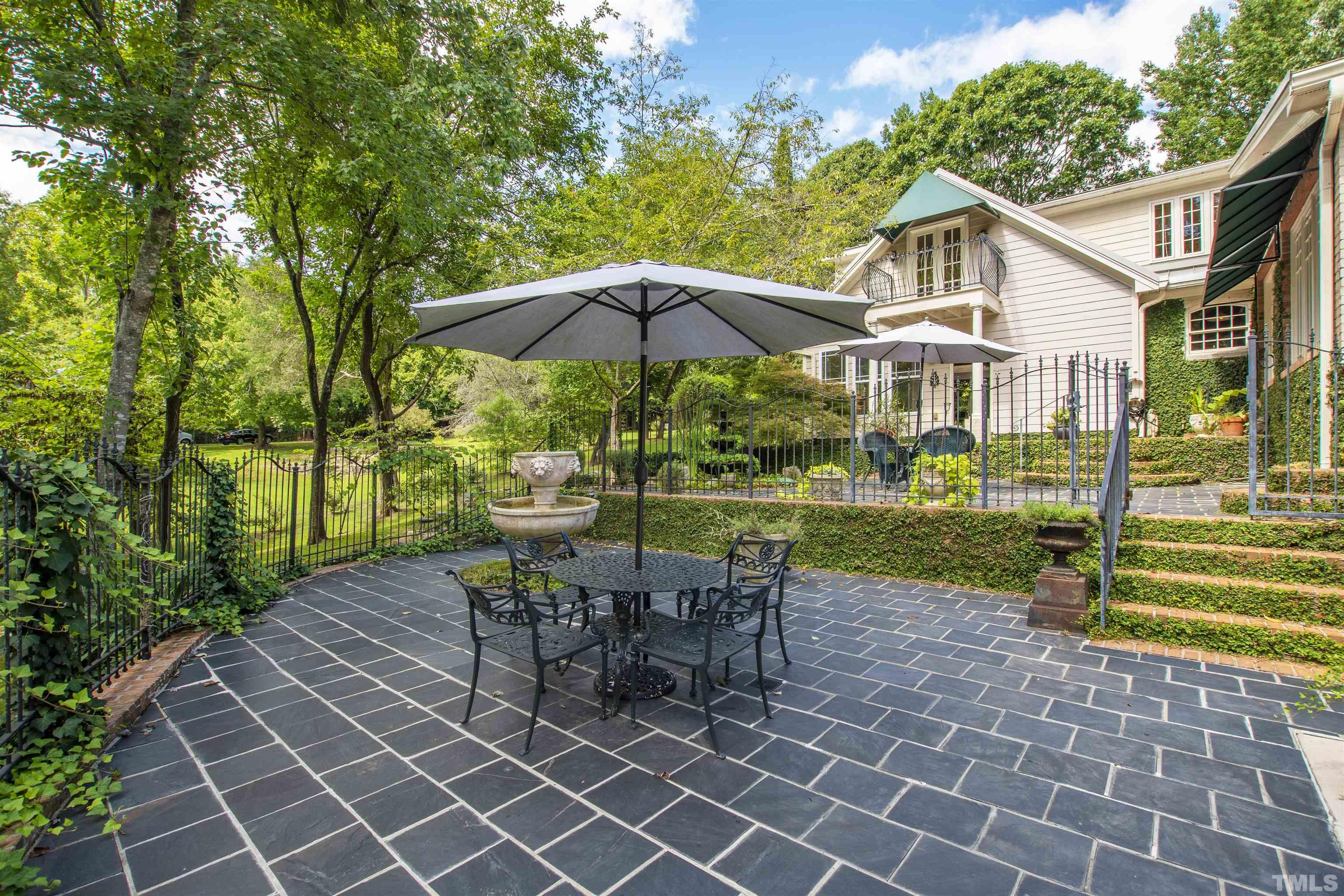 2429 Kirks Ridge Drive Raleigh, NC 27606 - Photo 13 of 65 a view of a house with backyard sitting area and garden