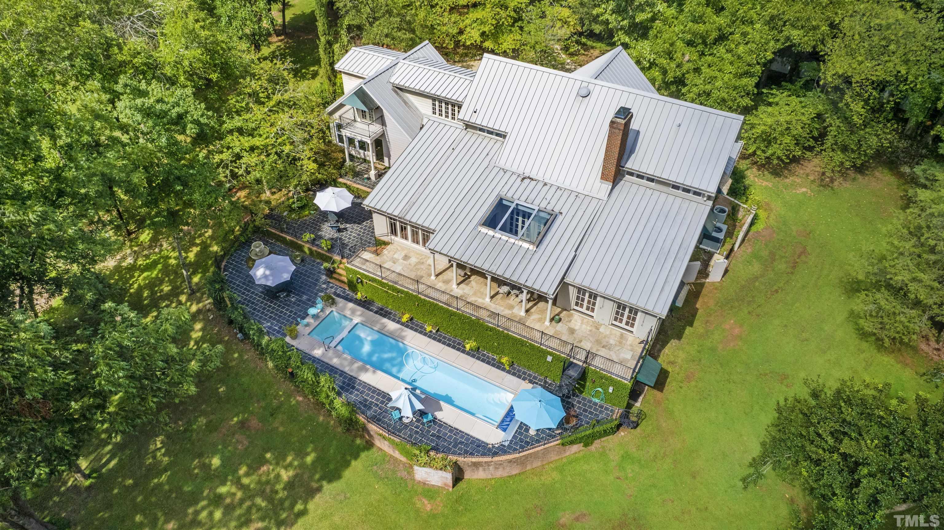 2429 Kirks Ridge Drive Raleigh, NC 27606 - Photo 15 of 65 an aerial view of a house with a swimming pool