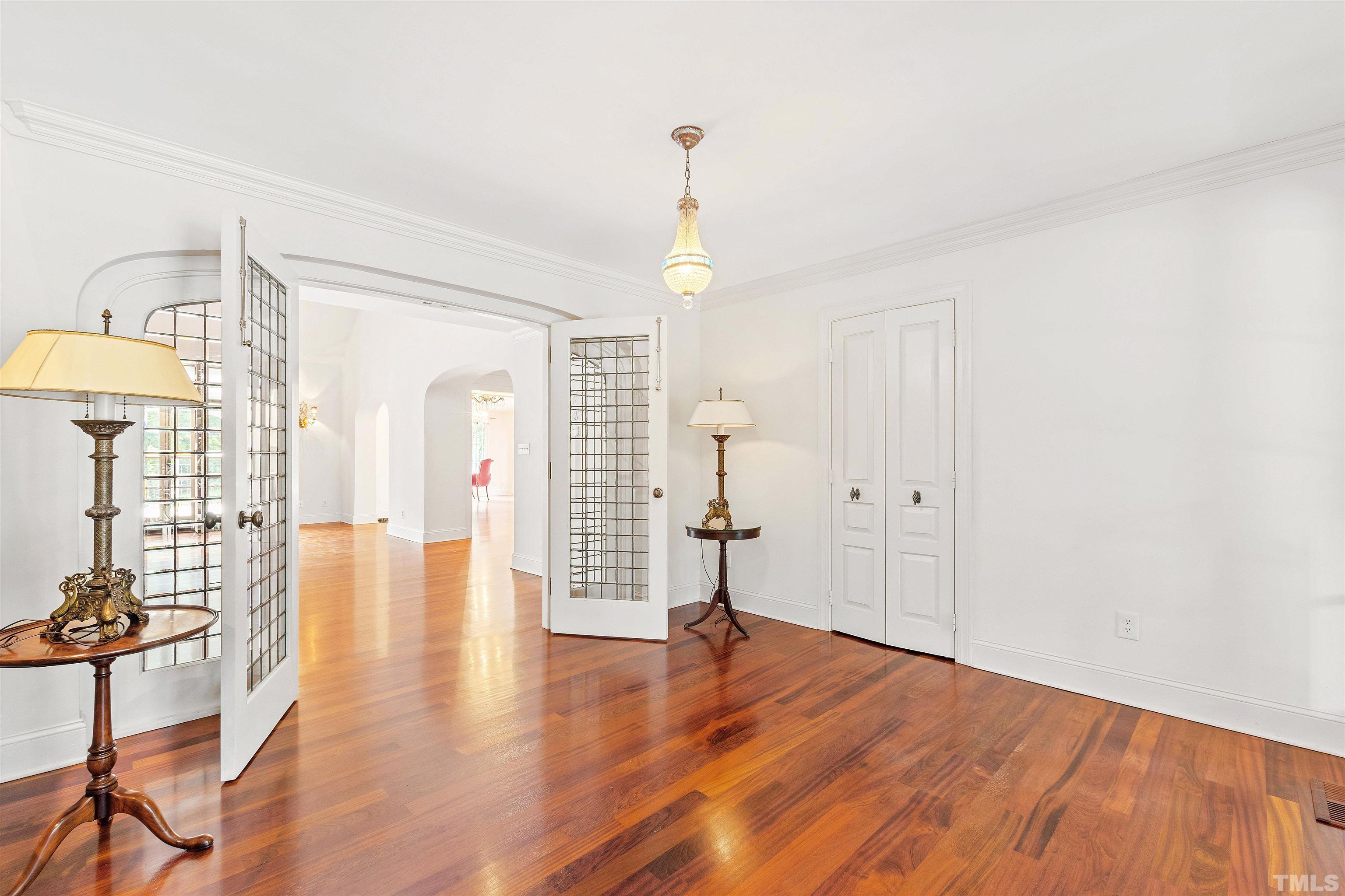 2429 Kirks Ridge Drive Raleigh, NC 27606 - Photo 20 of 65 a view of empty room with wooden floor and fan