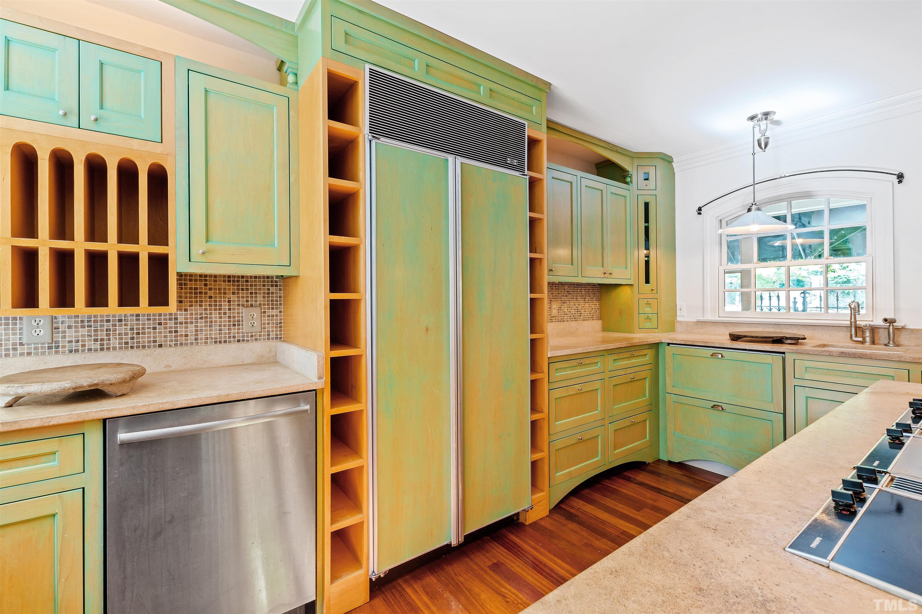 2429 Kirks Ridge Drive Raleigh, NC 27606 - Photo 32 of 65 a kitchen with a refrigerator and a sink