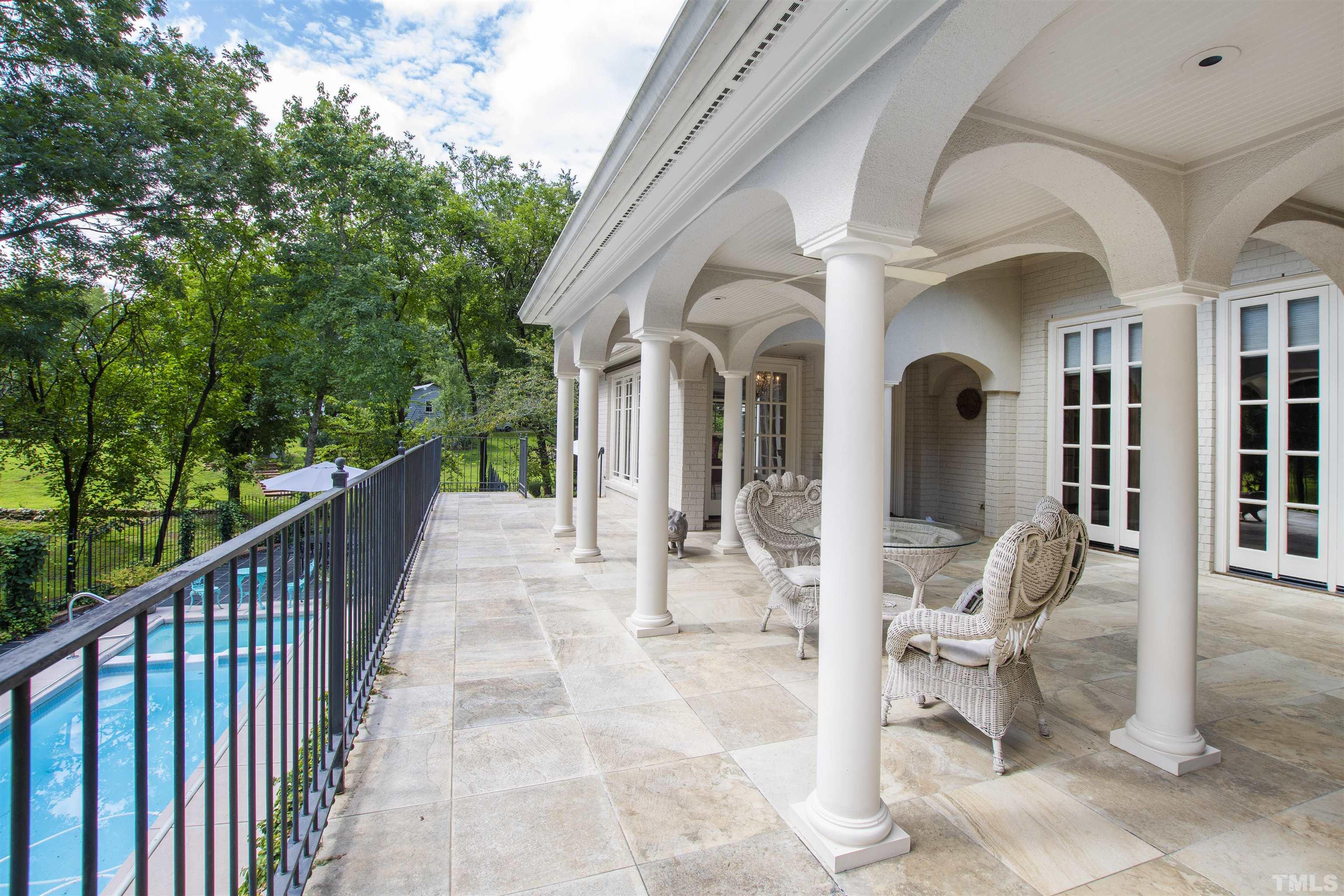 2429 Kirks Ridge Drive Raleigh, NC 27606 - Photo 39 of 65 a view of a patio with table and chairs and wooden fence