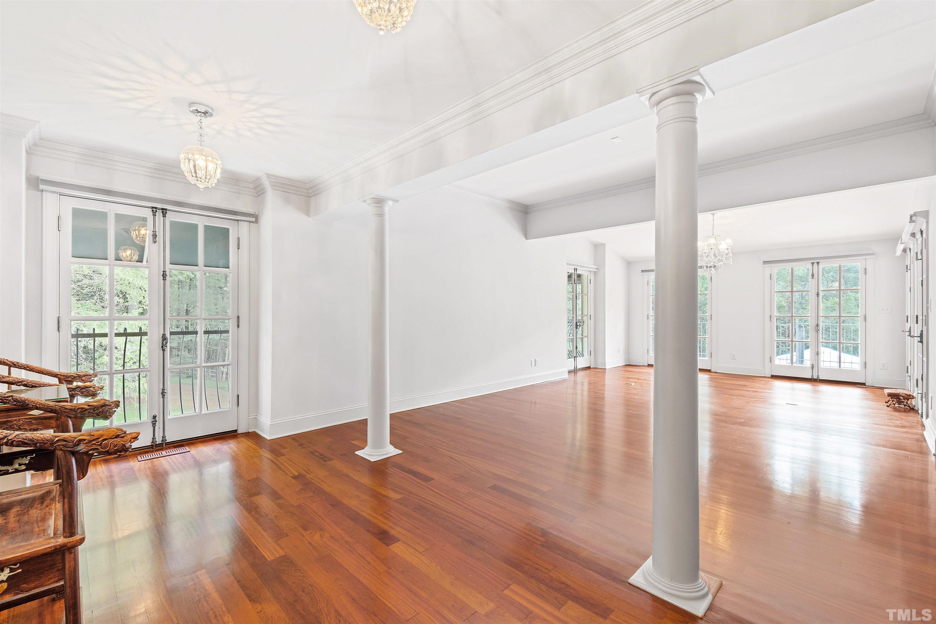 2429 Kirks Ridge Drive Raleigh, NC 27606 - Photo 44 of 65 a view of empty room with wooden floor and fan