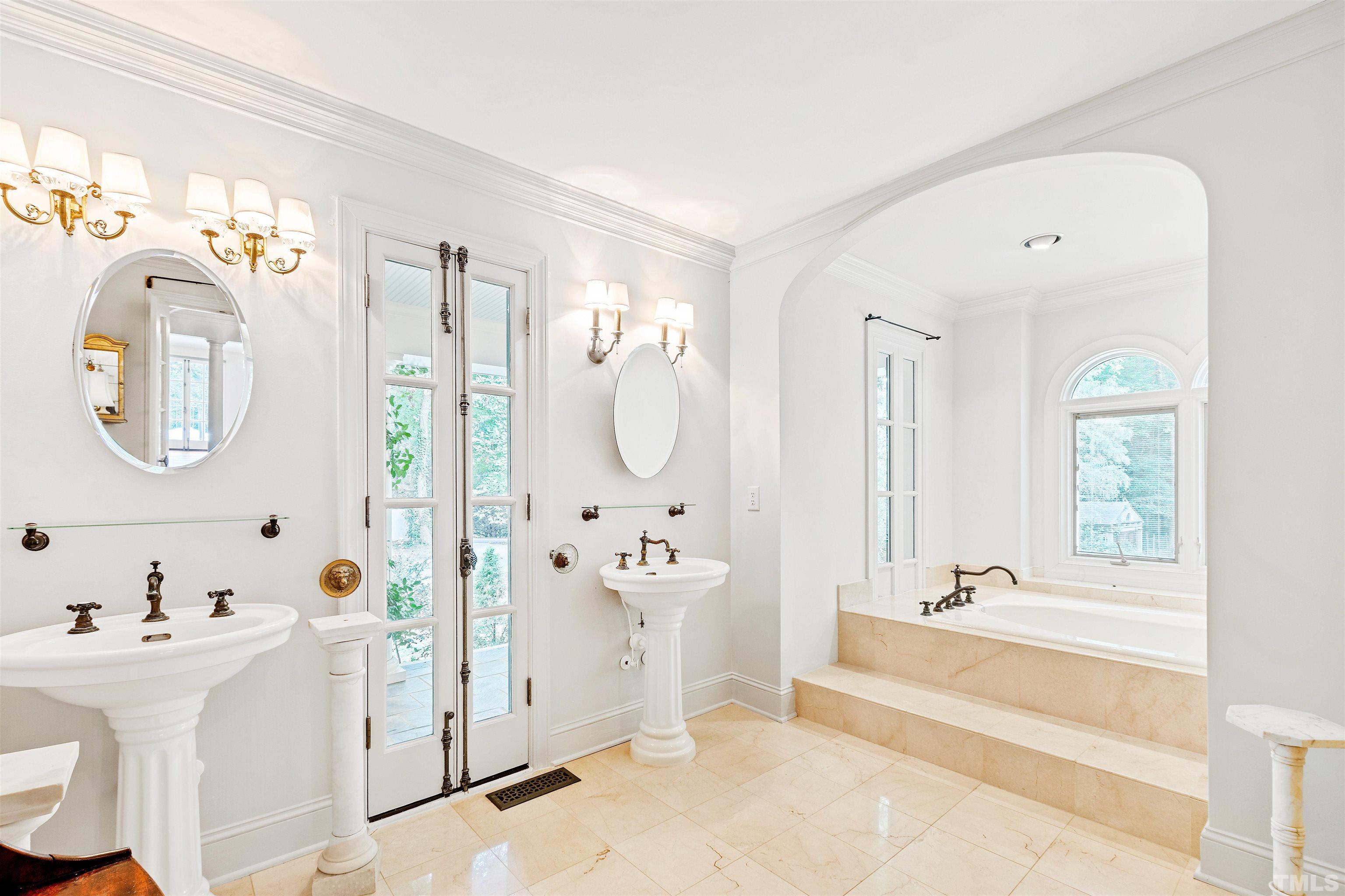 2429 Kirks Ridge Drive Raleigh, NC 27606 - Photo 45 of 65 a bathroom with a tub sink and mirror