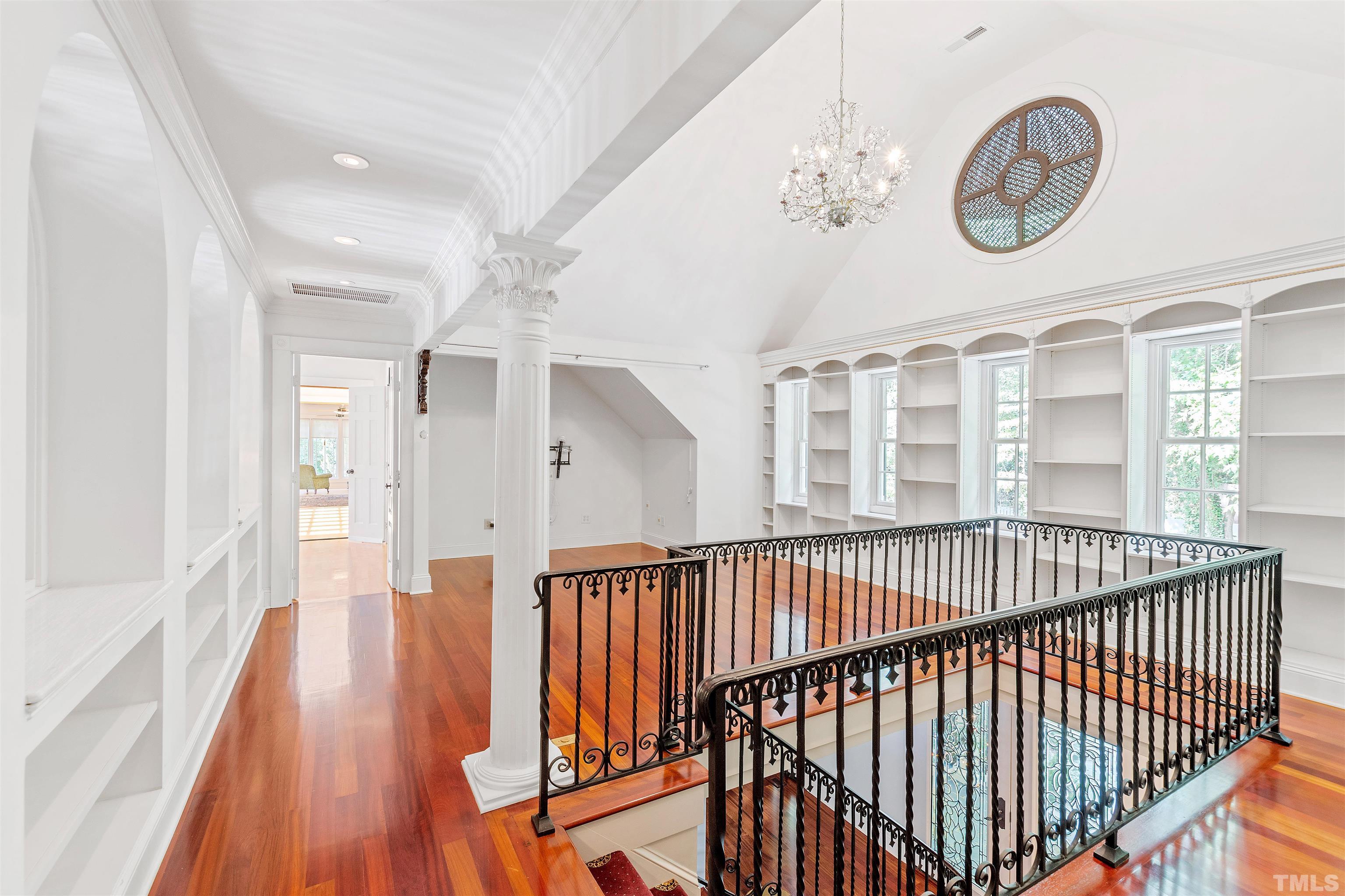 2429 Kirks Ridge Drive Raleigh, NC 27606 - Photo 49 of 65 a view of a hallway with wooden floor