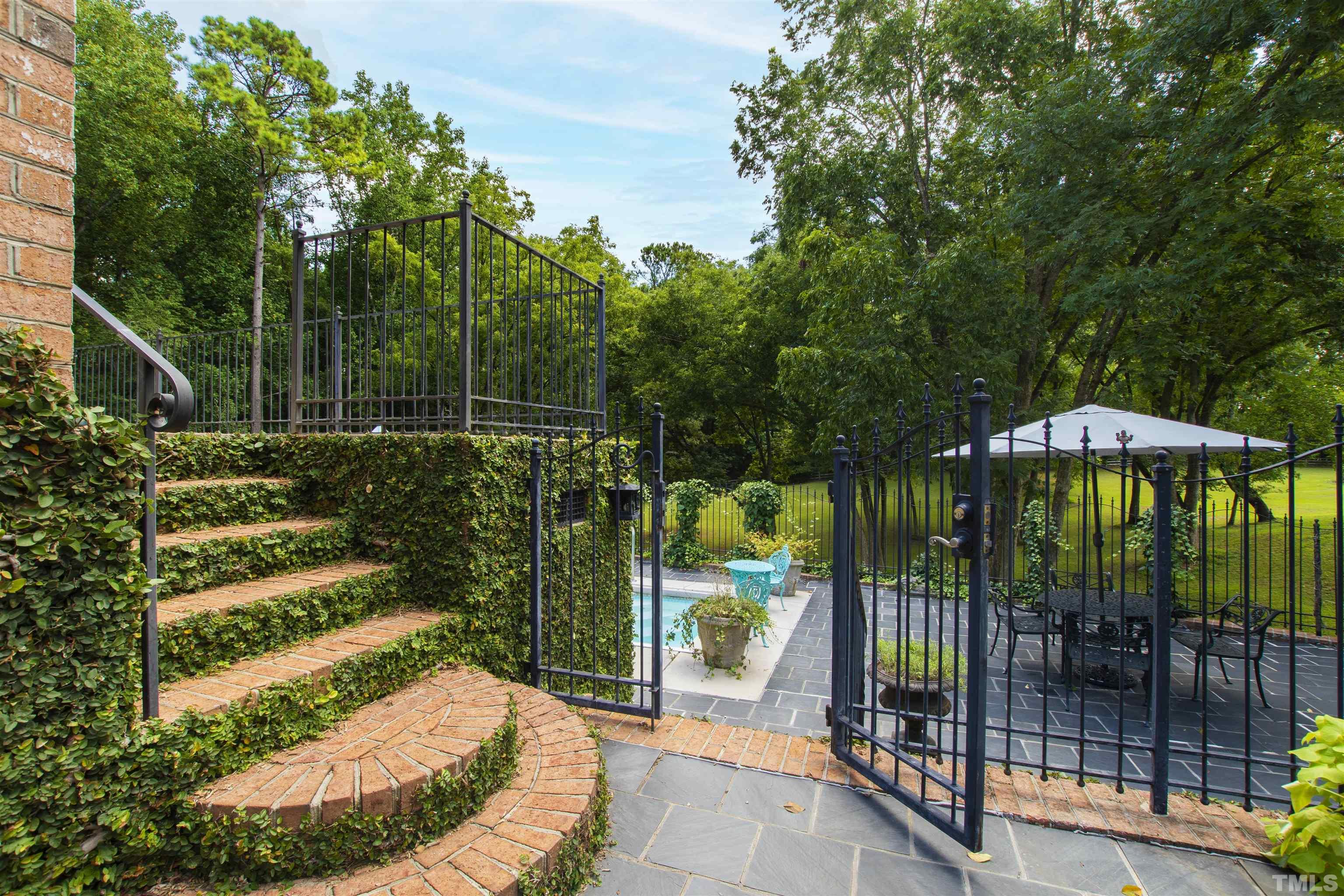 2429 Kirks Ridge Drive Raleigh, NC 27606 - Photo 5 of 65 a view of a balcony with plants
