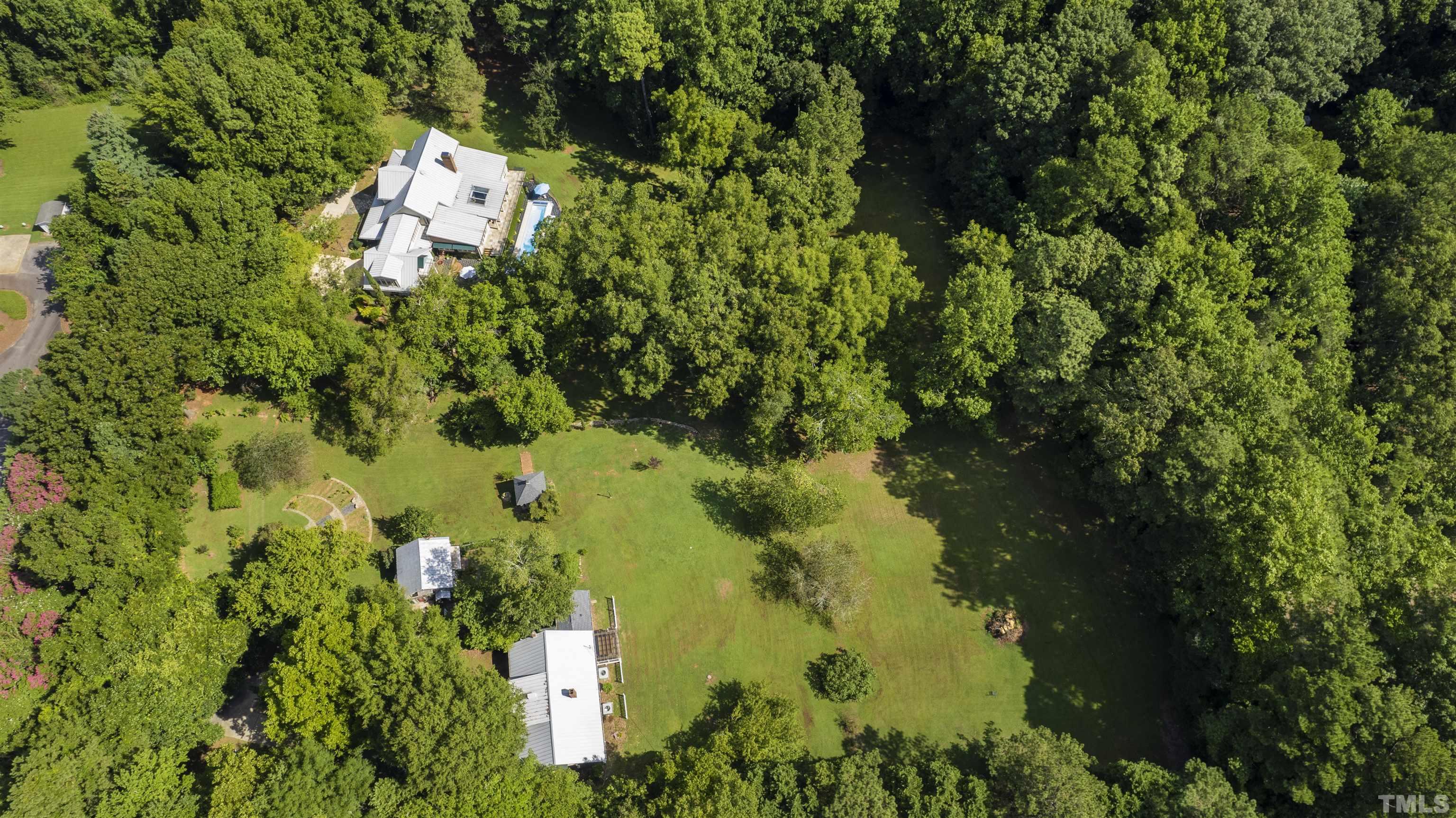 2429 Kirks Ridge Drive Raleigh, NC 27606 - Photo 62 of 65 an aerial view of residential house with yard and outdoor seating