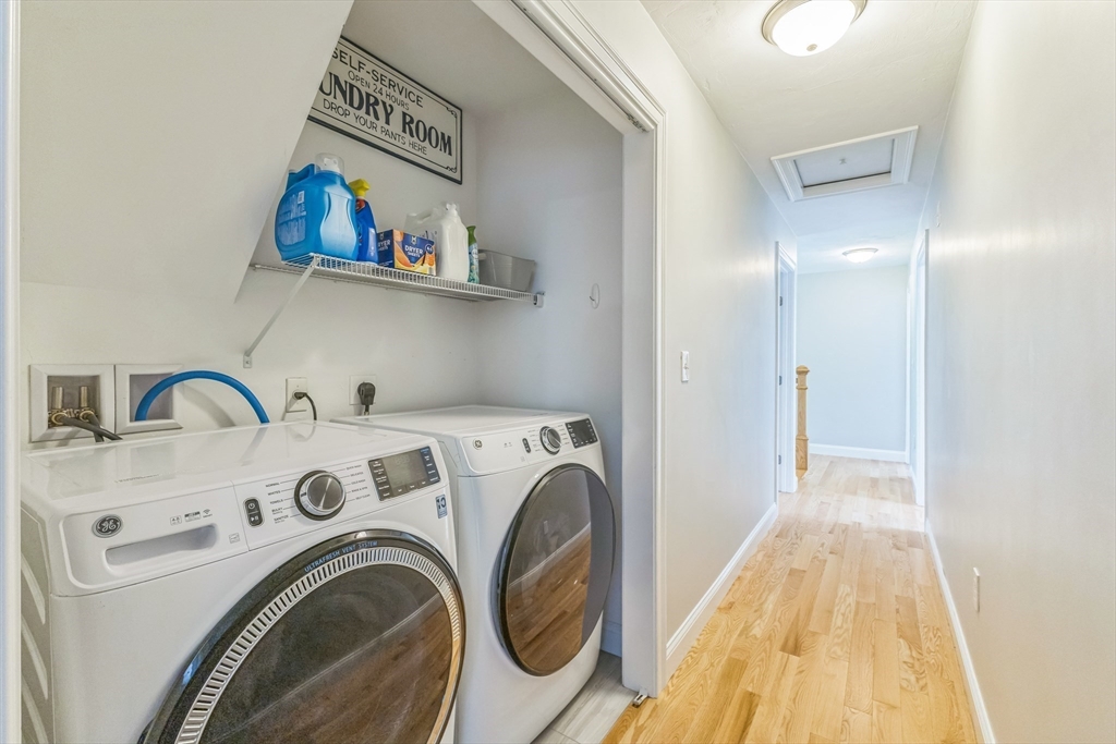 82 Sutton Street Uxbridge, MA 01569 - Photo 22 of 31 a view of storage and utility room with washer and dryer