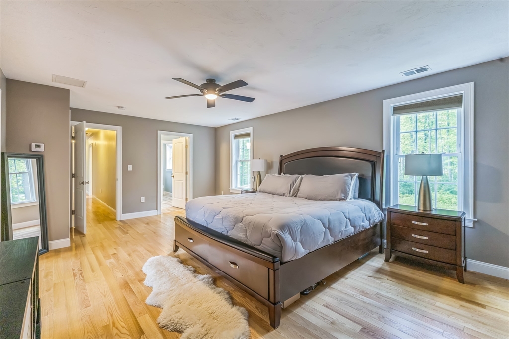 82 Sutton Street Uxbridge, MA 01569 - Photo 23 of 31 a spacious bedroom with a bed and wooden floor